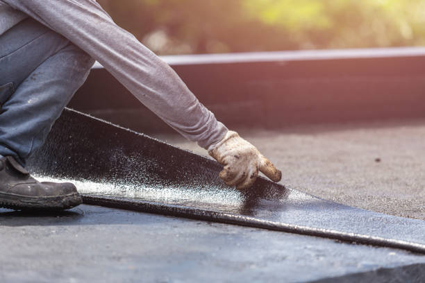 Professional Waterproofing technician working in Mumford, NY